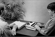 Picture of two people working with the TeleBraille